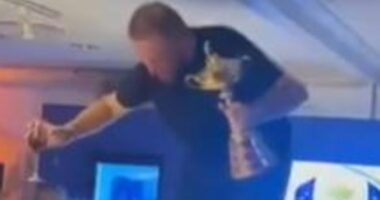 Waking up with a hangover... and a £230,000 bar bill! Europe's Ryder Cup hero Shane Lowry dances on a table as details of their wild after-party emerge