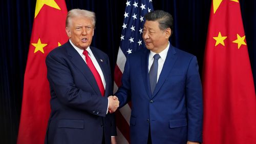 U.S. President Donald Trump greets Chinese President Xi Jinping ahead of a bilateral meeting at Gimhae Air Base on October 30, 2025 in Busan, South Korea.