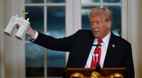 President Donald Trump addresses a dinner for donors who have contributed to build the new ballroom at the White House, Wednesday, Oct. 15, 2025, in Washington. (AP Photo/John McDonnell)