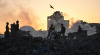 Palestinians search for firewood and plastic at a landfill in Gaza City Saturday, Oct. 25, 2025. (AP Photo/Abdel Kareem Hana)