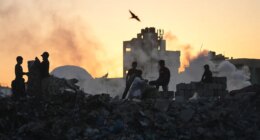 Palestinians search for firewood and plastic at a landfill in Gaza City Saturday, Oct. 25, 2025. (AP Photo/Abdel Kareem Hana)