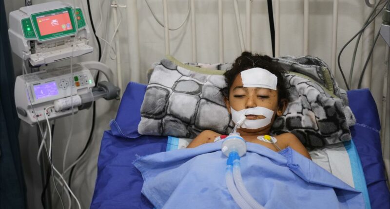 A bomb in Gaza's rubble wounds twins who thought it was a toy