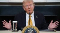 President Donald Trump answers questions from reporters during a roundtable on criminal cartels in the State Dining Room of the White House