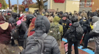 GIF of agents clashing with protesters in Portland at an ICE facility