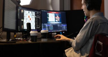 This undated photo released by Charlotte Chess Center shows Daniel Naroditsky playing chess at the computer. (Kelly Centrelli/Charlotte Chess Center via AP)