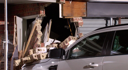 Driver cracked open drink after car ploughed into family home, witnesses allege