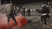 Federal troops deploy red tear gas during protest