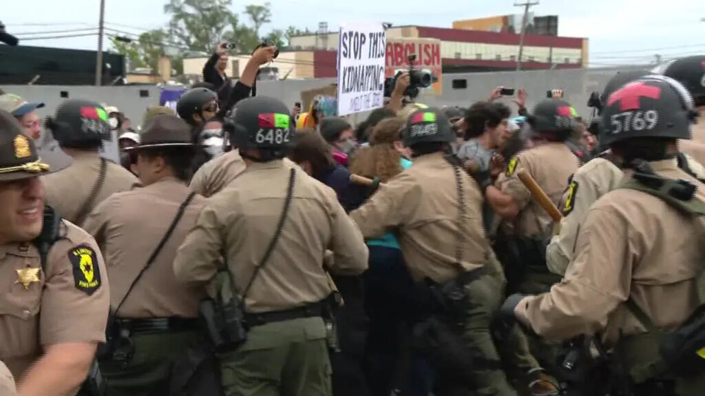 Protesters clash with police in riot gear outside ICE processing facility in Broadview, Illinois on Friday October 17 2025.