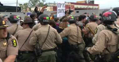 Protesters clash with police in riot gear outside ICE processing facility in Broadview, Illinois on Friday October 17 2025.