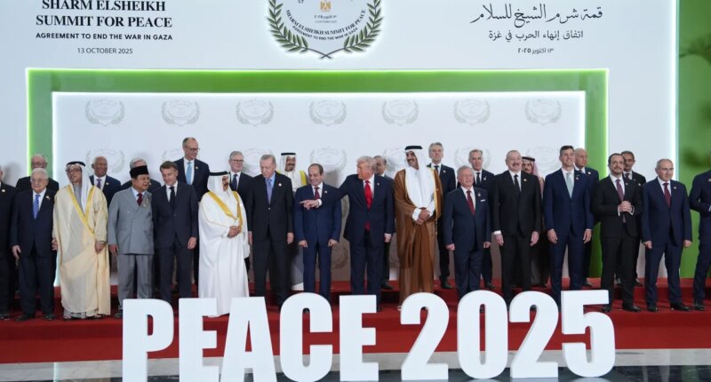 President Donald Trump and other leaders gather for a family photo during a summit to support ending the more than two-year Israel-Hamas war in Gaza after a breakthrough ceasefire deal, Monday, Oct. 13, 2025, in Sharm El Sheikh, Egypt. (AP Photo/Evan Vucci, Pool)