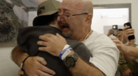 Israeli hostages freed: Father stands from wheelchair to embrace Bar Kuperstein (Video)