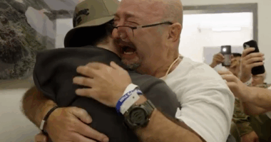 Israeli hostages freed: Father stands from wheelchair to embrace Bar Kuperstein (Video)