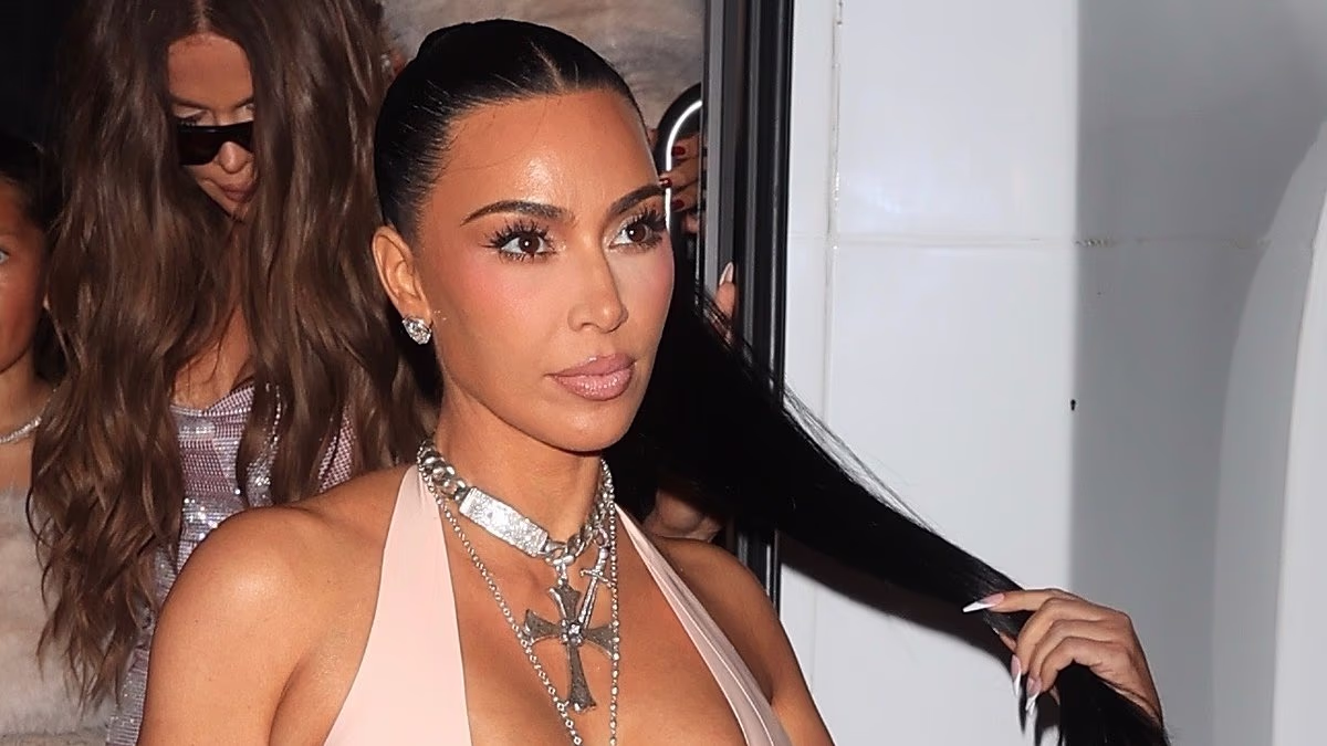 Kim Kardashian nearly spills out of VERY low-cut latex gown