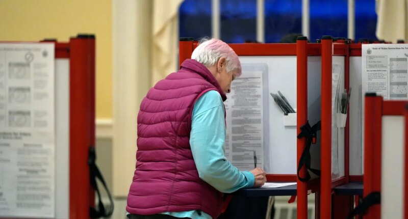 FILE - A voter marks a ballot at the polling station in Kennebunk, Maine, March 5, 2024. (AP Photo/Michael Dwyer, File)