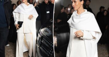 Meghan Markle bursts into laughing fit among stoic crowd at Fashion Week show