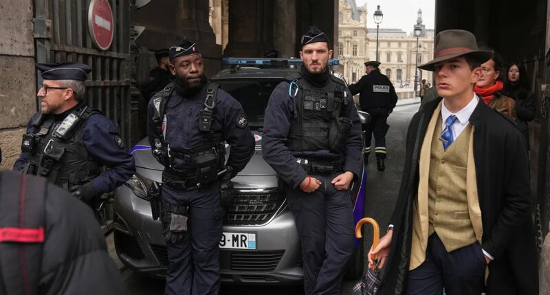 Mystery man in dapper suit goes viral after appearing in Louvre heist investigation photo