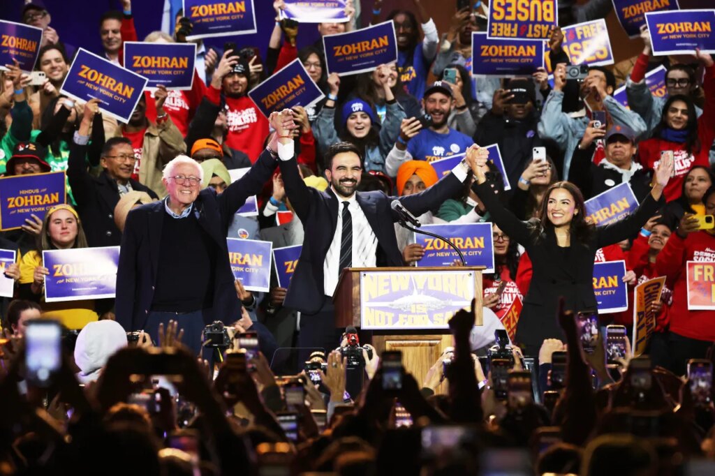 Sen. Bernie Sanders, I-Vt., left, New York City mayoral candidate Zohran Mamdani, center, and Rep. Alexandria Ocasio-Cortez, D-N.Y., appear on stage during a rally, Sunday, Oct. 26, 2025, in New York. (AP Photo/Heather Khalifa)