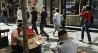 Shoppers sit down for a rest in Pitt St Mall in the Sydney CBD.