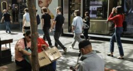 Shoppers sit down for a rest in Pitt St Mall in the Sydney CBD.