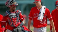 FILE - Los Angeles Angels starting pitcher Tyler Skaggs (45) talks with catcher Martin Maldonado, left, after warming up in the bullpen prior to a spring training baseball game against the Chicago White Sox, March 4, 2017, in Glendale, Ariz. (AP Photo/Ross D. Franklin, File)