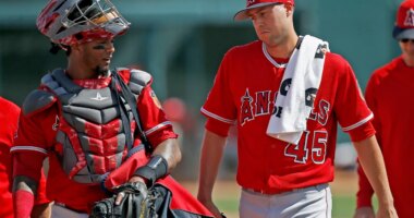 FILE - Los Angeles Angels starting pitcher Tyler Skaggs (45) talks with catcher Martin Maldonado, left, after warming up in the bullpen prior to a spring training baseball game against the Chicago White Sox, March 4, 2017, in Glendale, Ariz. (AP Photo/Ross D. Franklin, File)