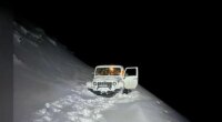 Photos: Florida dad, son rescued after snow strands vehicle on Colorado summit
