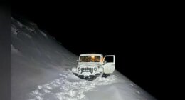 Photos: Florida dad, son rescued after snow strands vehicle on Colorado summit