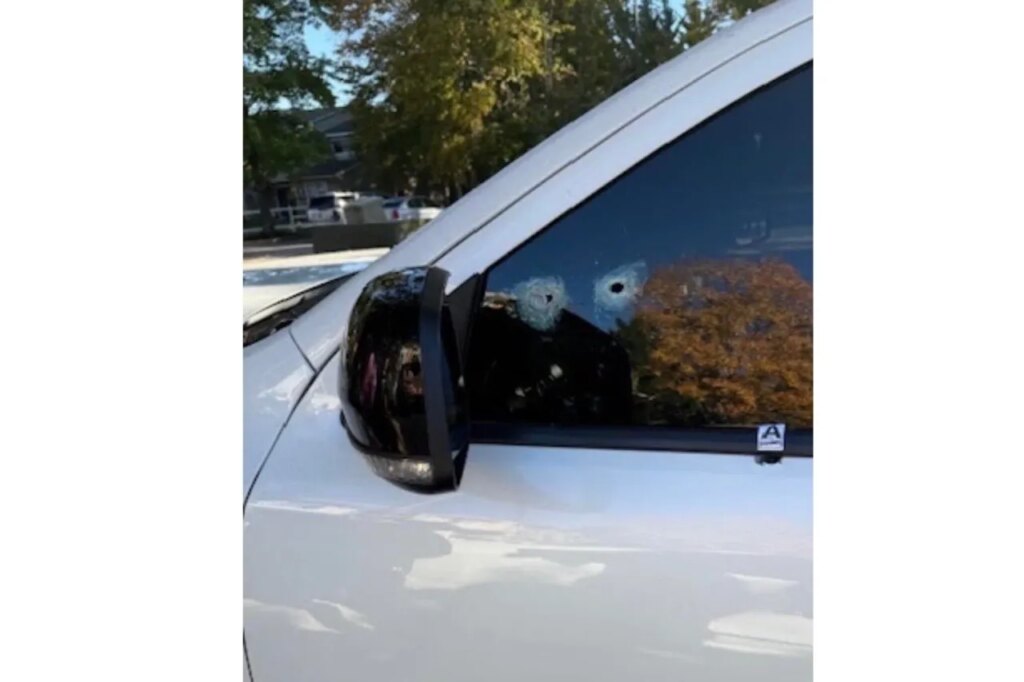 This image provided by Elizabeth Paige White shows bullet holes in a vehicle of Phillip M. Brown after a Homeland Security Investigations agent fired shots Oct. 17, 2025, in Washington, during a traffic stop. (Elizabeth Paige White via AP)