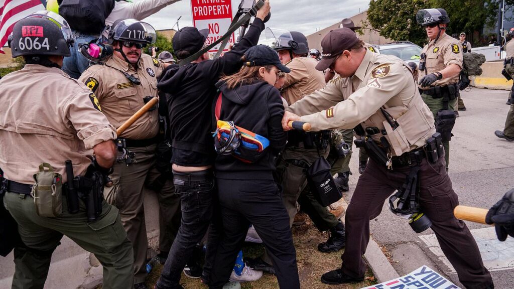 Protesters clash with police outside ICE facility in Chicago