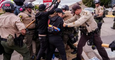 Protesters clash with police outside ICE facility in Chicago