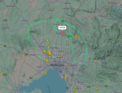 A﻿ Melbourne flight bound for Singapore is diverting back to Tullamarine airport after witnesses described seeing it flying low and dumping fuel.
