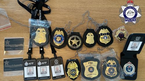 Fake law enforcement badges and identification were seized.