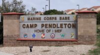 FILE - The entrance to Marine Corps base Camp Pendleton is seen on Sept. 22, 2015, in Oceanside, Calif. (AP Photo/Gregory Bull, File)