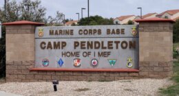 FILE - The entrance to Marine Corps base Camp Pendleton is seen on Sept. 22, 2015, in Oceanside, Calif. (AP Photo/Gregory Bull, File)