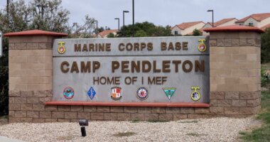 FILE - The entrance to Marine Corps base Camp Pendleton is seen on Sept. 22, 2015, in Oceanside, Calif. (AP Photo/Gregory Bull, File)