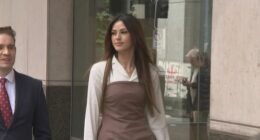 20-year-old Sarah Mouhanna walking to court.