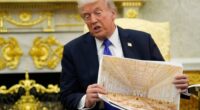 President Donald Trump holds an artist rendering of the interior of the new White House ballroom.