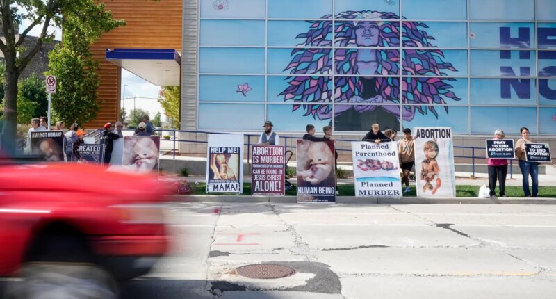 FILE - Protesters are seen outside Planned Parenthood, Sept. 18, 2023, in Milwaukee. (AP Photo/Morry Gash, File)