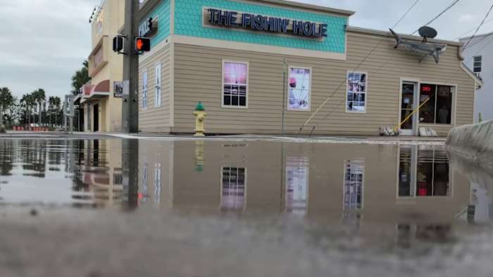 ‘Will be lapping on our door:’ Shop owners battle flooding on North Beach Street