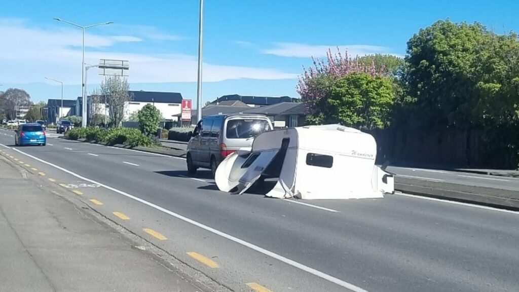 Bizarre moment driver is pictured towing a caravan without any wheels along city street: 'Absolute chaos'
