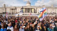 Britain is 'obviously not a safe country': Thousands of Jewish people come together to mourn two men killed in terror attack