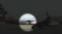Footage shows the moment a Jetstar flight began taxiing with a cargo door wide open.