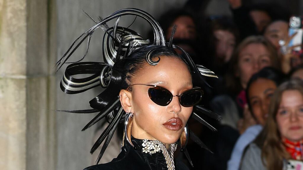 FKA Twigs stuns in black leather as she attends the Schiaparelli show