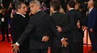 George Clooney puts on cheeky display with pals at Jay Kelly premiere