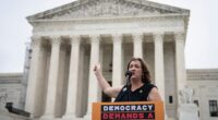 Rep. Katie Porter speaks during a small rally in front of the Supreme Court building