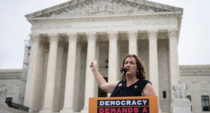 Rep. Katie Porter speaks during a small rally in front of the Supreme Court building