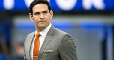 Mark Sanchez walks on the field before an NFL football game