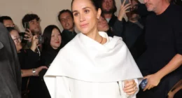 Meghan Markle Caught on Camera Laughing as Model Stumbles on Catwalk During Paris Fashion Week