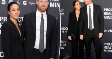 Meghan Markle stuns in black suit for rare red carpet appearance with Prince Harry