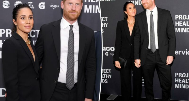 Meghan Markle stuns in black suit for rare red carpet appearance with Prince Harry
